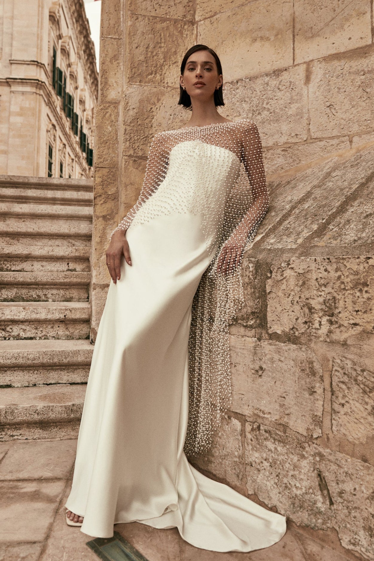 Leonora (With Cape) : A strapless, bias-cut wedding gown paired with a dramatic pearl cape