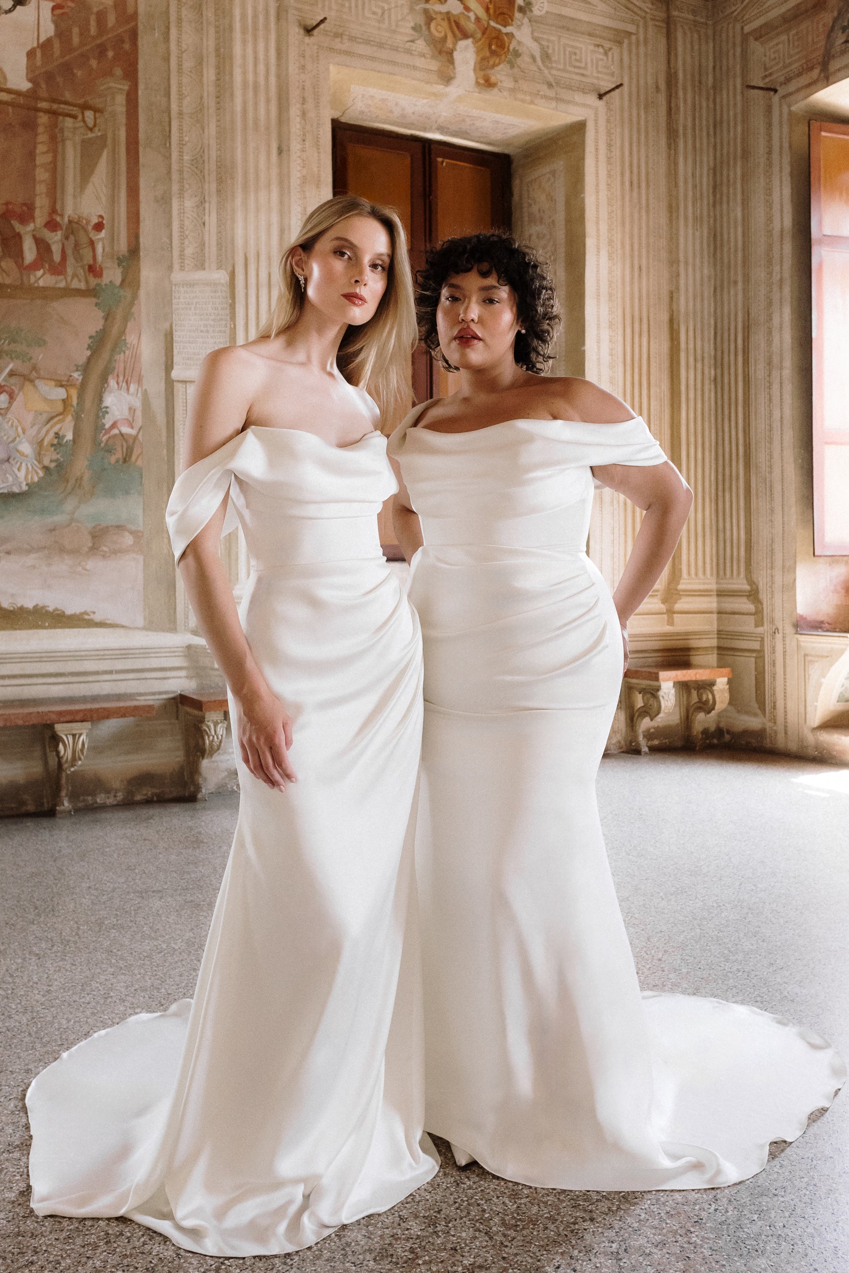 Athena : A sumptuous satin wedding dress with off-shoulder draped sleeves