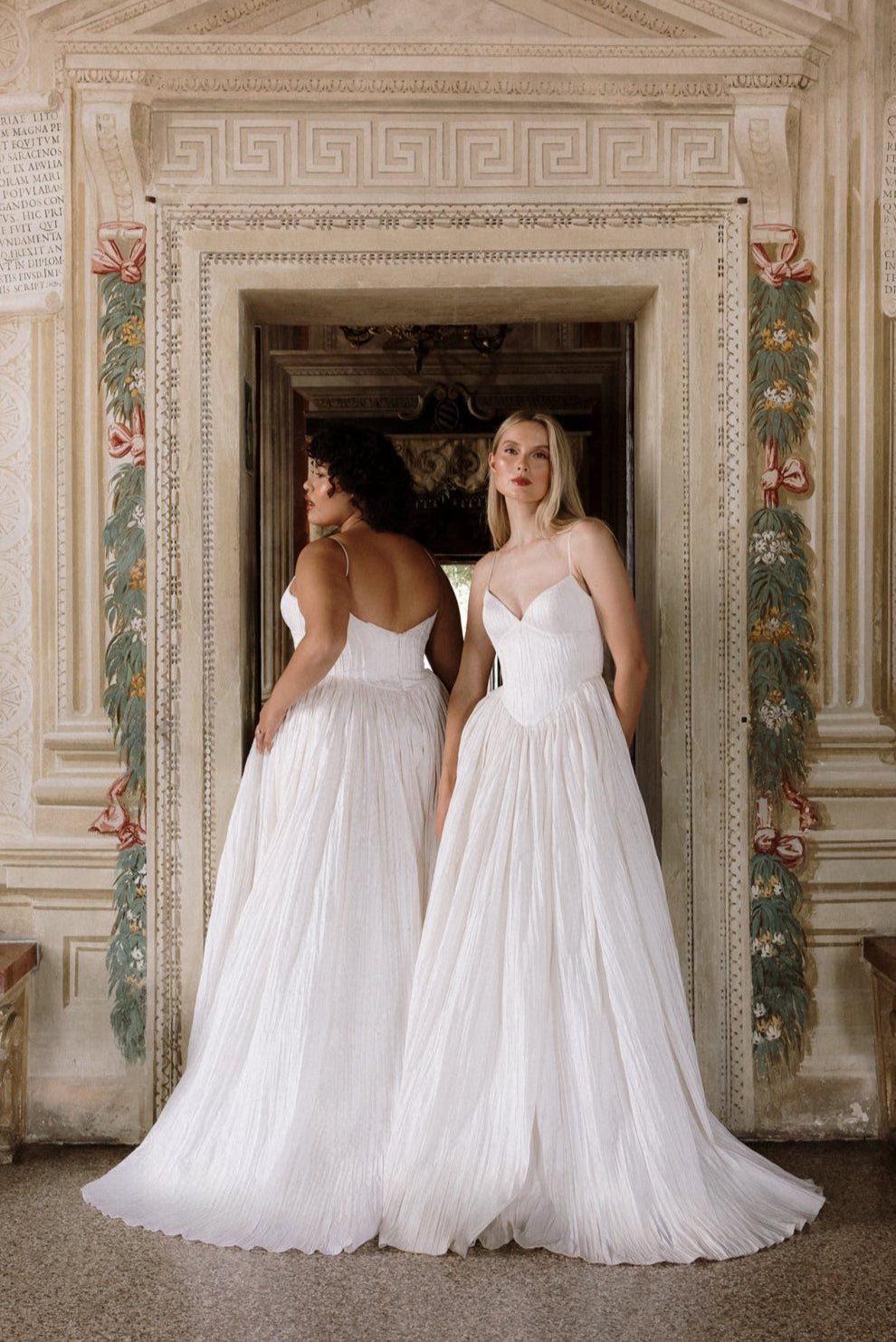 Rhea : A unique pleated wedding dress with an exaggerated basque waist