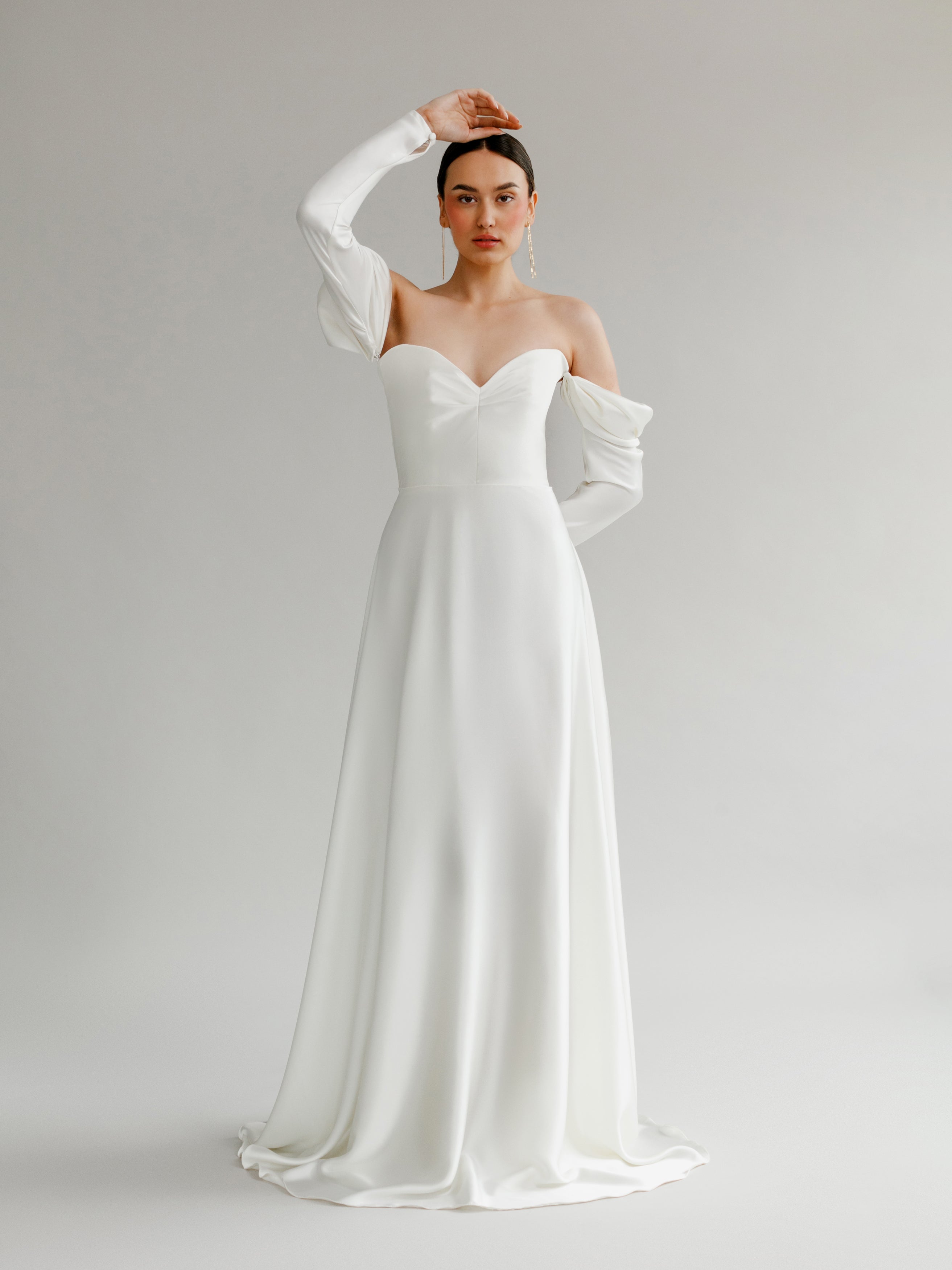 Augusta : A strapless wedding gown with a pleated bodice and draped of ...