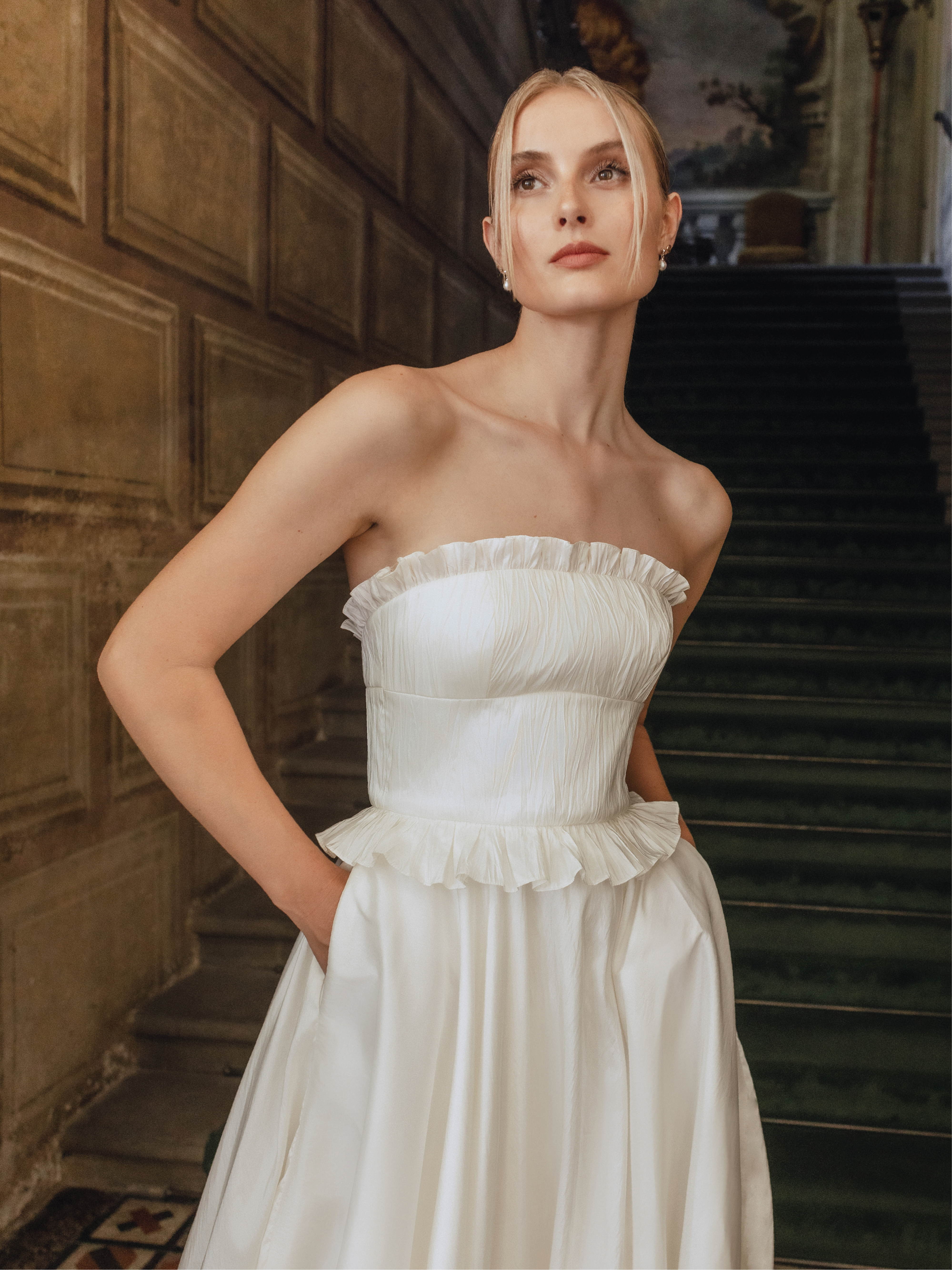 Kahlo : A taffeta wedding gown with frill detailing along the neckline + waist