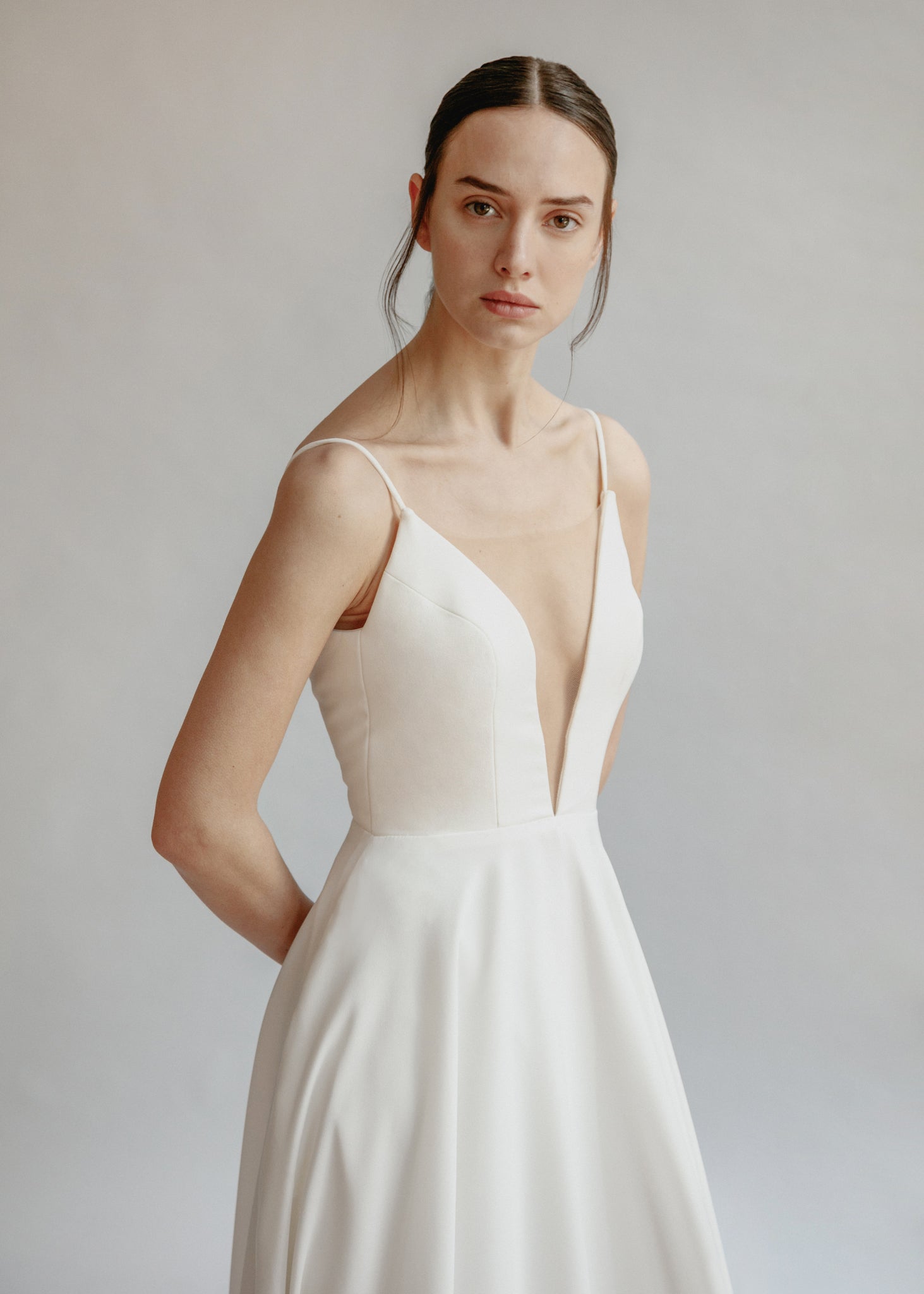 Low cut simple a-line wedding dress with pockets and an extra long train